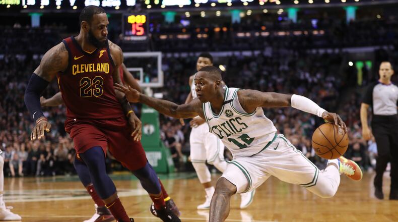 BOSTON, MA - MAY 13: Terry Rozier #12 of the Boston Celtics is defended by LeBron James #23 of the Cleveland Cavaliers during the fourth quarter in Game One of the Eastern Conference Finals of the 2018 NBA Playoffs at TD Garden on May 13, 2018 in Boston, Massachusetts. The Boston Celtics defeated the Cleveland Cavaliers 108-83. (Photo by Maddie Meyer/Getty Images)