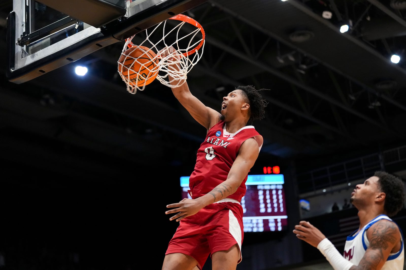 Miami (Ohio) guard Eian Elmer (0) dunks during the second half of a First Four college basketball game against SMU in the NCAA Tournament in Dayton, Ohio, Wednesday, March 18, 2026. (AP Photo/Jeff Dean)