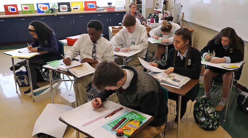 Catholic Central students work in class Monday, Feb. 4, 2019. BILL LACKEY/STAFF