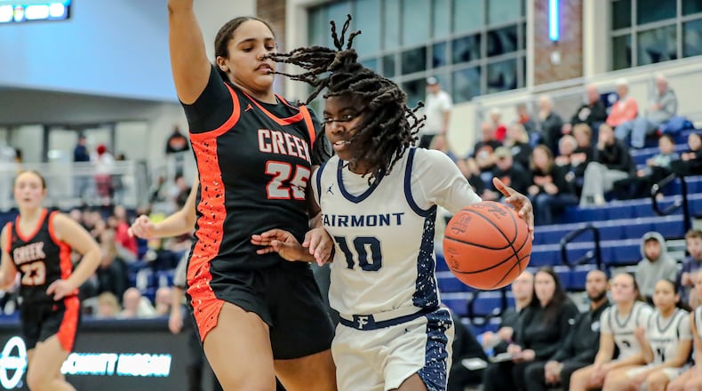 Fairmont High School's Janiyah Hargrave drives to the hoop against Beavercreek's Cameron King during their game last season at Fairborn High School. MICHAEL COOPER/CONTRIBUTED