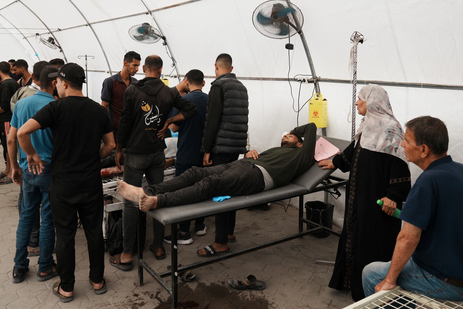 Palestinians lie on stretchers at the Baptist Hospital after being injured in an Israeli airstrike in Gaza City, Friday, May 30, 2025. (AP Photo/Jehad Alshrafi)