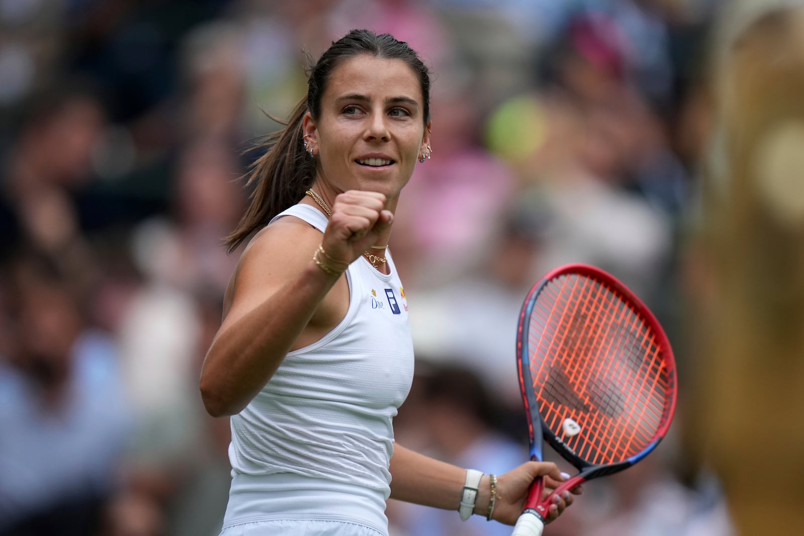 Emma Navarro of the U.S. celebrates winning the women's singles third round match against Barbora Krejcikova of Czech Republic at the Wimbledon Tennis Championships in London, Saturday, July 5, 2025.(AP Photo/Alastair Grant)