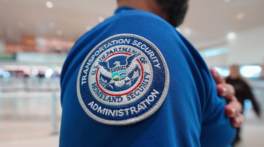 A TSA agent wears a U.S. Department of Homeland Security patch on their uniform at Love Field Airport, in Dallas, Wednesday, Feb. 18, 2026. (AP Photo/LM Otero)