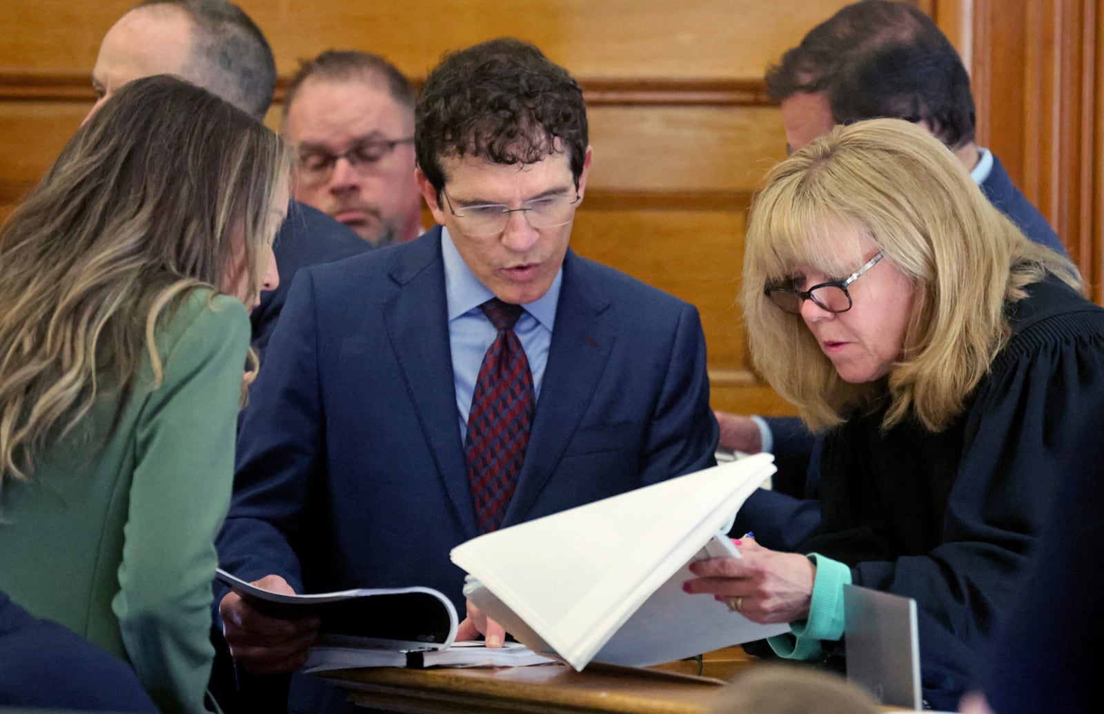 Defense attorney Robert Alessi, center, confers with Superior Court Judge Beverly Cannone as Karen Read, left, stands by during a sidebar during Read's murder trial at Norfolk Superior Court, Tuesday, May 27, 2025, in Dedham, Mass. (Matt Stone/The Boston Herald via AP, Pool)/The Boston Herald via AP, Pool)