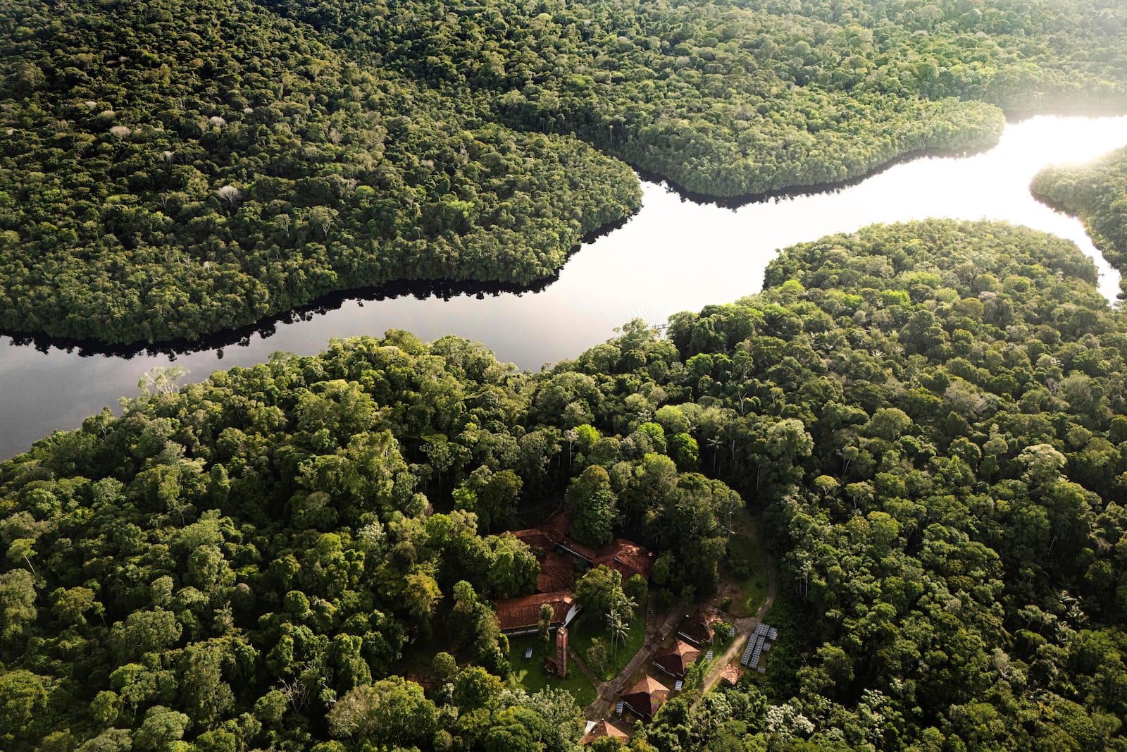 The Curua River crosses the Caxiuana National Forest with Emilio Goeldi Museum's scientific station at bottom in Para state, Brazil, Saturday, March 22, 2025. (AP Photo/Jorge Saenz)