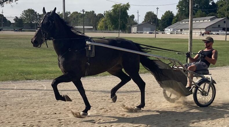 Mike Richardson Jr. takes Aruba Kat for a training run at the Champaign County Fairgrounds. CONTRIBUTED