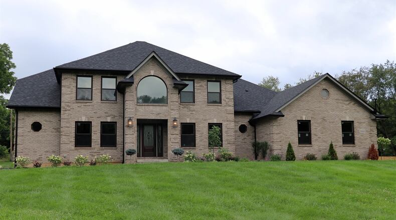 Located within a pocket cul-de-sac along the Stillwater River banks, the brick two-story at 5500 Beejay Court has about 4,892 square feet of living space including the finished walk-out basement. Listed for $750,000 by Home Experts Realty, the secluded 1.2-acre property has a tree-lined and wood privacy-fenced back yard and includes a new storage barn with covered porch. CONTRIBUTED