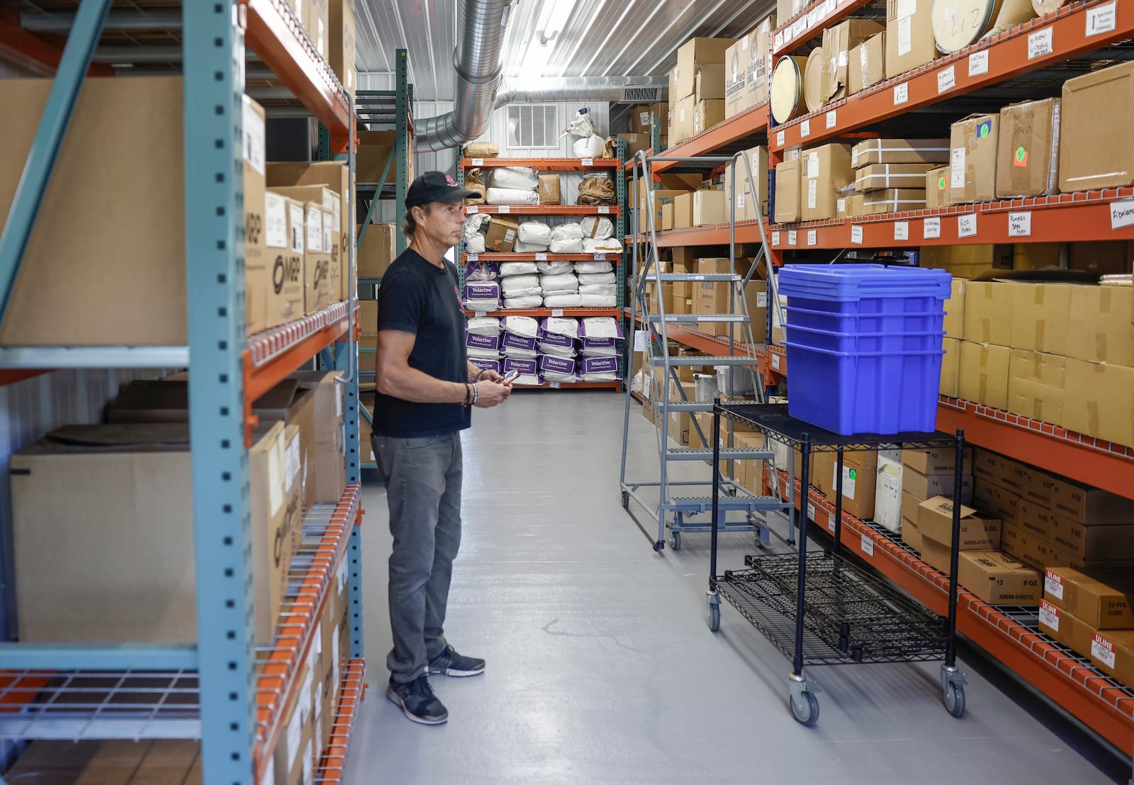 CEO/Founder Lindsey Duncan looks at stacked boxes and supplies in a warehouse of the new manufacturing plant of All-In Nutritionals on Monday, September 29, 2025, in Springfield. JOSEPH COOKE/STAFF