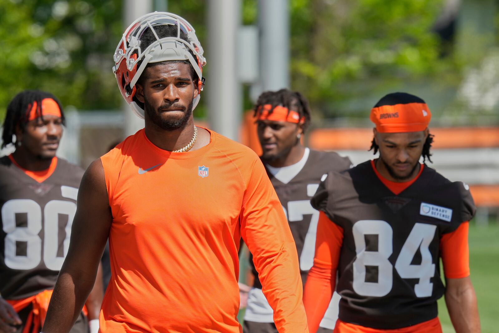 Cleveland Browns quarterback Shedeur Sanders, front, walks off the field after the NFL football team's rookie minicamp in Berea, Ohio, Saturday, May 10, 2025. (AP Photo/Sue Ogrocki)