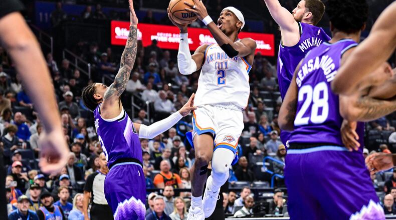 Oklahoma City Thunder guard Shai Gilgeous-Alexander (2) shoots against Utah Jazz during the first half of an NBA basketball game, Wednesday, Jan. 7, 2025, in Oklahoma City. (AP Photo/Gerald Leong)