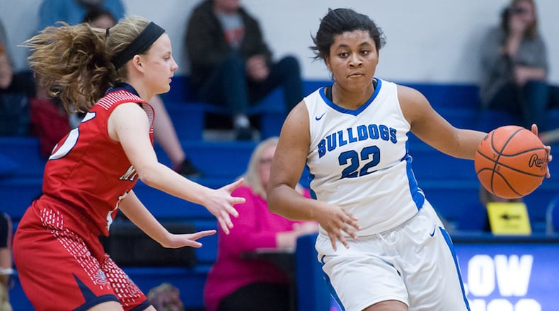 Elizabeth Smith dribbles with pressure from Miami Valley’s Kristi Campbell during a Metro Buckeye Conference game on Thursday night. Smith is closing in on 1,500 career points. Contributed Photo by Bryant Billing