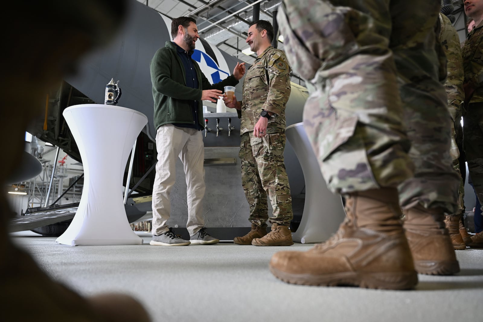 U.S. Vice President JD Vance gives a toast to U.S. service members during a refueling stop at Ramstein Air Base, Germany, Thursday, April 24, 2025. (Kenny Holston/The New York Times via AP, Pool)