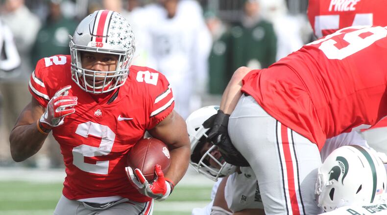 Ohio States J.K. Dobbins runs against Michigan State on Saturday, Nov. 11, 2017, at Ohio Stadium in Columbus. David Jablonski/Staff
