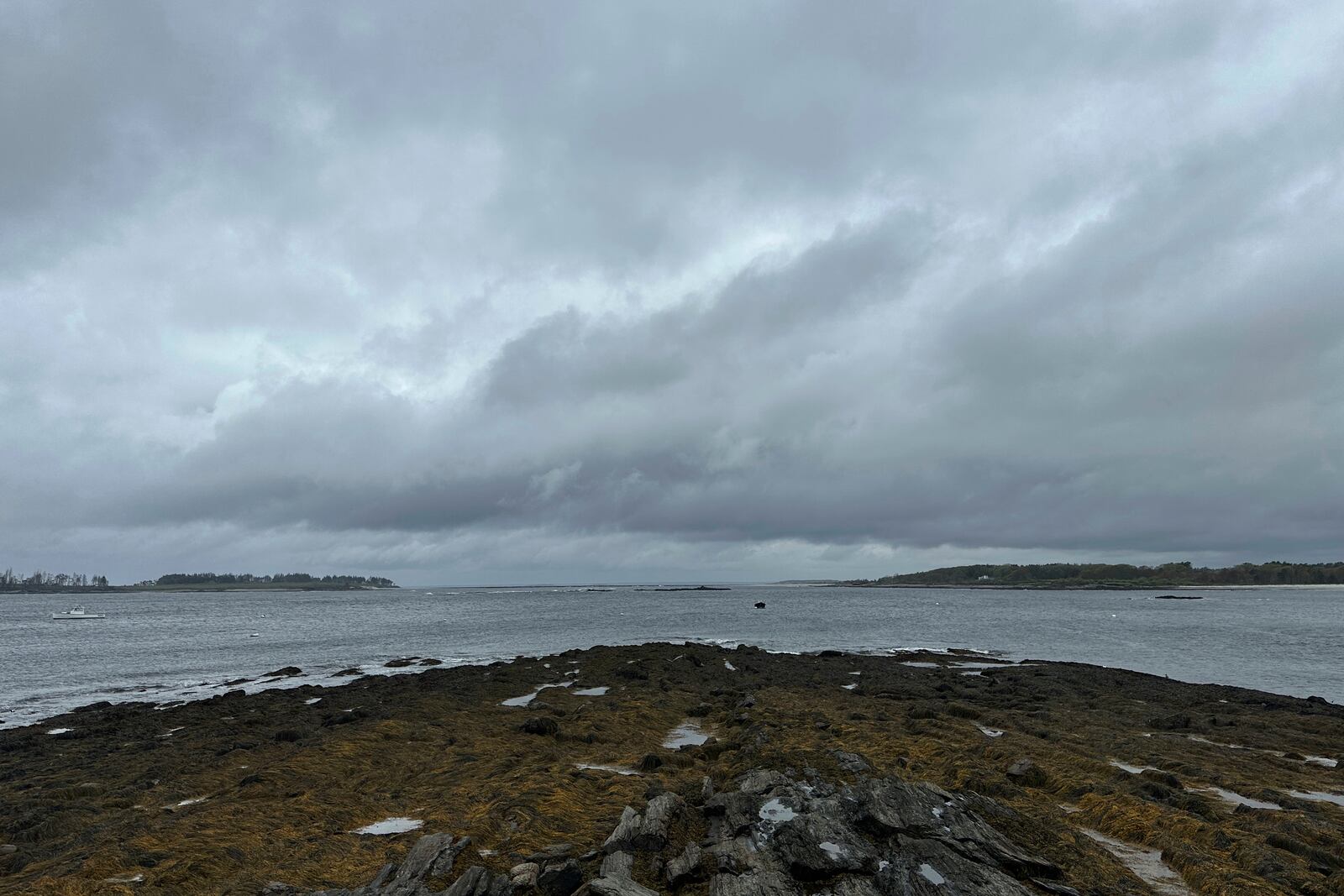 Dark skies at Kettle Cove State Park, Thursday, May 22, 2025, in Cape Elizabeth, Maine. (AP Photo/Patrick Whittle)
