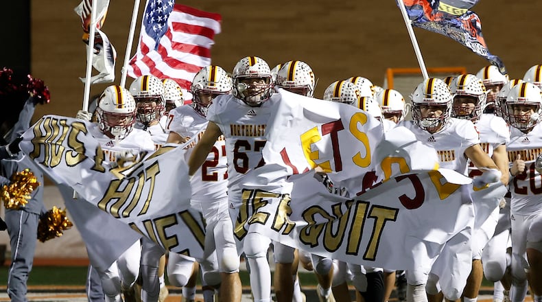 The Northeastern Jets take the field at Waynesville Friday to start the game. BILL LACKEY/STAFF
