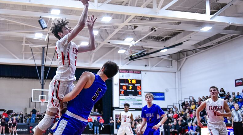 Franklin’s Caden Johnson goes up for a shot defended by Brookville’s Wes Turner. NICK GRAHAM/STAFF