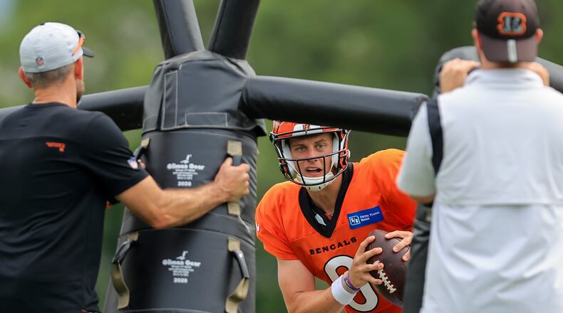 Cincinnati Bengals' Joe Burrow participates in a drill during NFL football practice in Cincinnati, Tuesday, Aug. 10, 2021. (AP Photo/Aaron Doster)