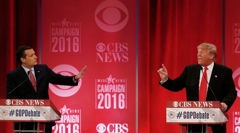 GOP DEBATE--Republican presidential candidate, businessman Donald Trump, right, and Republican presidential candidate, Sen. Ted Cruz, R-Texas, speak at the same time during the CBS News Republican presidential debate at the Peace Center, Saturday, Feb. 13, 2016, in Greenville, S.C. (AP Photo/John Bazemore)