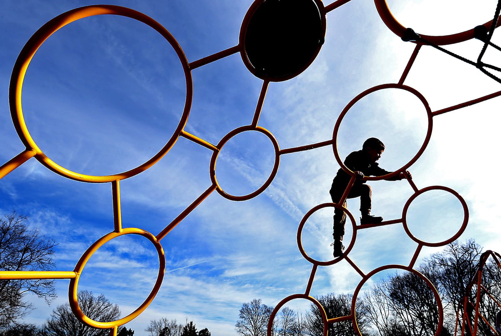 A child plays on the playground at Smith Park in New Carlisle in this file photo. The city is seeking a $400,000 grant to build a second shelter in the park.  BILL LACKEY / STAFF
