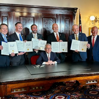 Ohio Gov. Mike DeWine signs a series of bills meant to address rising property taxes in Ohio on Dec. 19, 2025. Photo by Avery Kreemer.