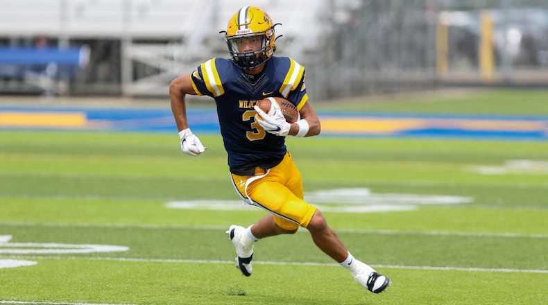 Cutline: Springfield High School senior Duncan Bradley III runs the ball during their scrimmage game against Louisville Trinity earlier this season in Springfield. CONTRIBUTED PHOTO BY MICHAEL COOPER