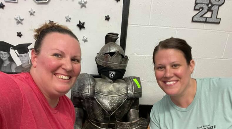 The Crabtree sisters, Stacie McConehea and Sarah Suarez say goodbye to the Greenon Knight in the Greenon High School office. Submitted photo