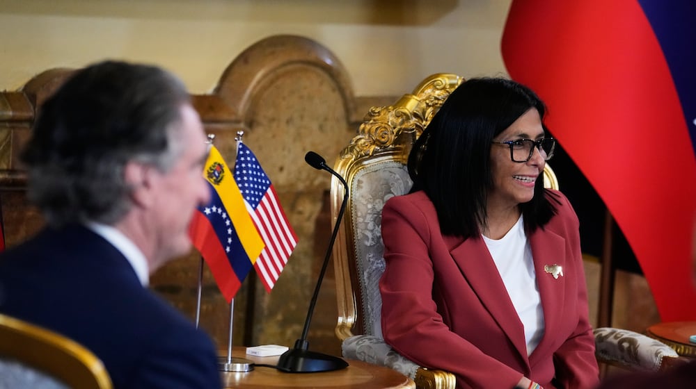 Venezuela's acting President Delcy Rodriguez, right, and U.S. Interior Secretary Doug Burgum meet at Miraflores presidential palace in Caracas, Venezuela, Wednesday, March 4, 2026. (AP Photo/Ariana Cubillos)