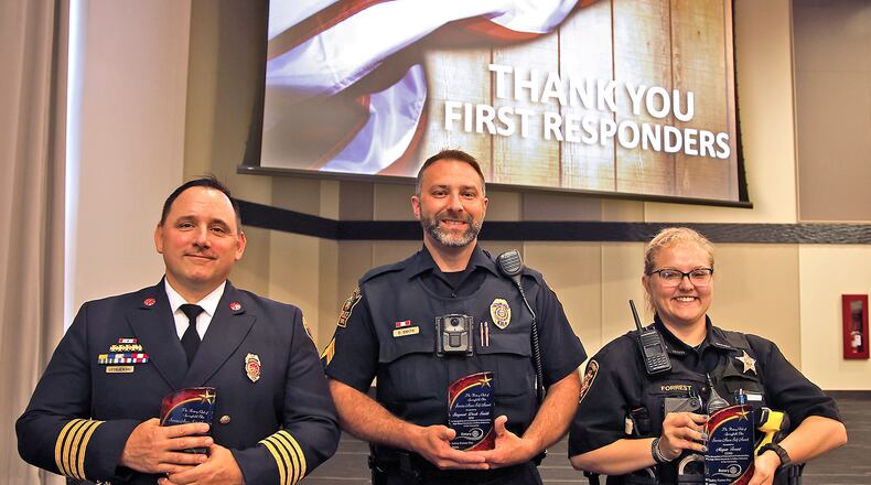 The Springfield Rotory Club celebrated Safety Forces Day Monday, May 20, 2024 by awarding four Service Above Self Awards. Pictured are, from left, Springfield Assistant Fire Chief Brian Leciejewski, Springfield Police Sergeant Derek Smith and Clark County Sheriff's Deputy Megan Forrest. Not pictured is Ohio Highway Patrol Trooper Bradley Baker. BILL LACKEY/STAFF