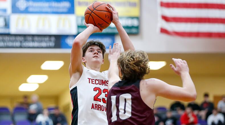 Tecumseh High School junior Collin O'Connor shoots the ball over Lebanon's Ben Smith during their game on Tuesday night at the Vandalia Butler Student Activity Center. CONTRIBUTED PHOTO BY MICHAEL COOPER