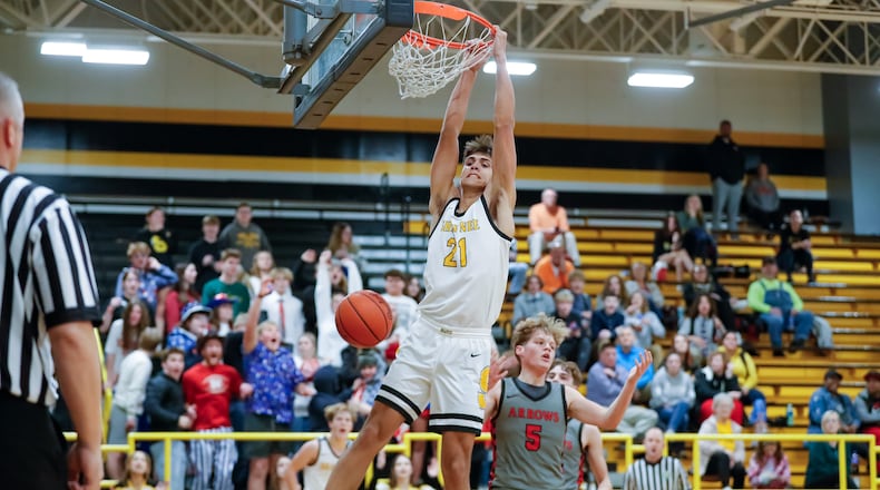 Shawnee High School junior Kyle Dingeman finishes off a dunk during their game against Tecumseh on Tuesday night in Springfield. The Braves won 60-47. Michael Cooper/CONTRIBUTED