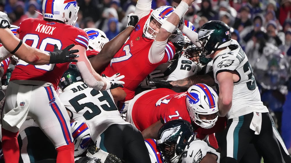 Buffalo Bills' Josh Allen (17) scores a touchdown during the second half of an NFL football game against the Philadelphia Eagles, Sunday, Dec. 28, 2025, in Buffalo, N.Y. (AP Photo/Gene J. Puskar)