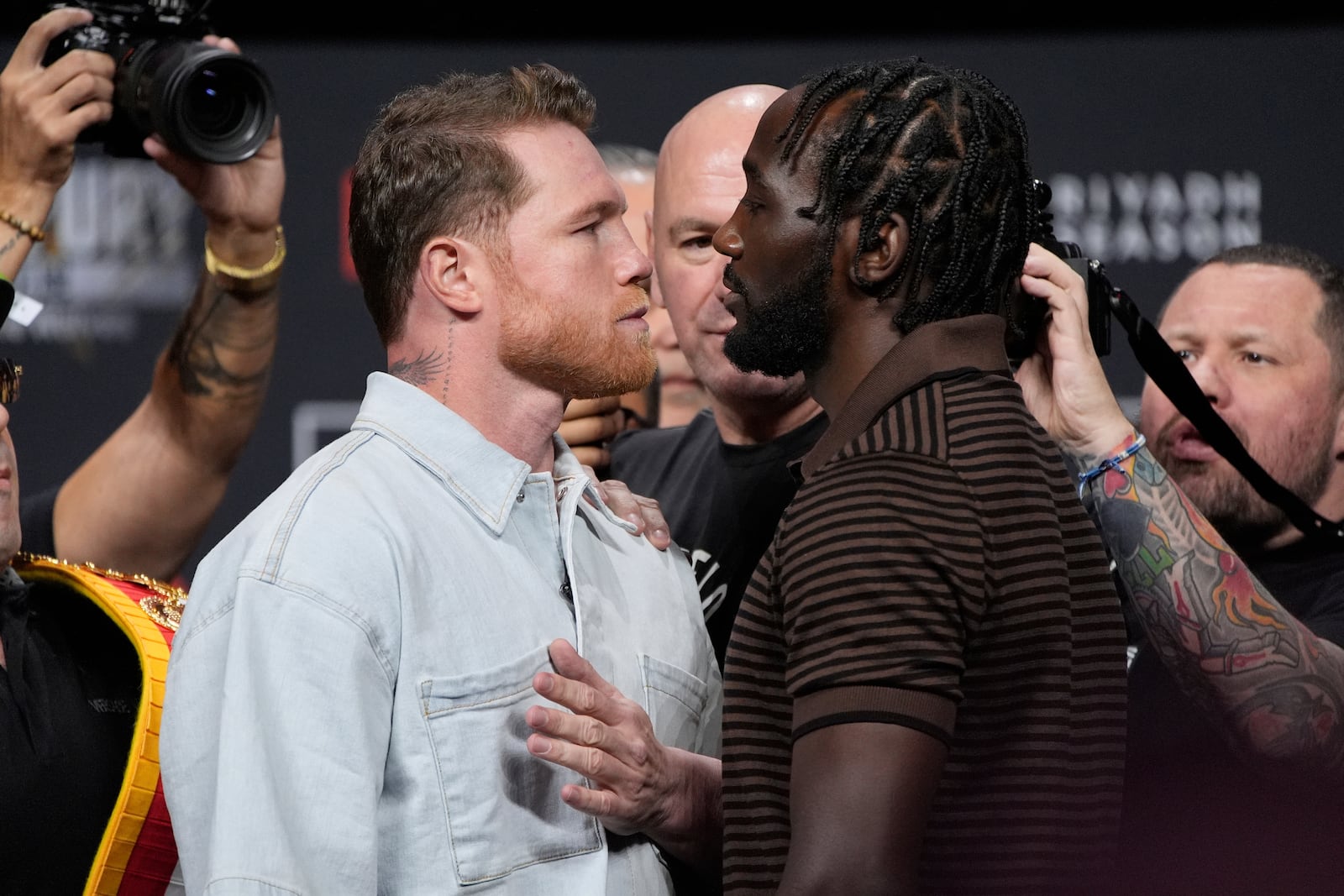 Canelo Alvarez, left, and Terence Crawford face off during a news conference for their upcoming boxing match Friday, June 27, 2025, in Las Vegas. (AP Photo/John Locher)