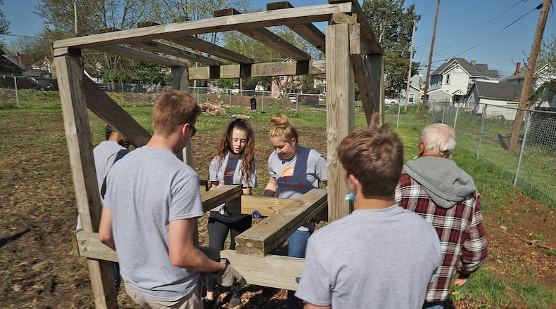 The 2023 Clark County Service Day will be held on Friday, Sept. 15, in partnership with the United Way of Clark, Champaign & Madison Counties, The Community Health Foundation, Mercy Health and The Nehemiah Foundation. In this file photo, volunteers from Catholic Central helped get the Promise Neighborhood's Community Garden ready a few years ago. BILL LACKEY/STAFF