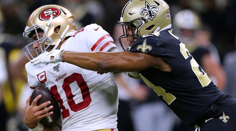NEW ORLEANS, LOUISIANA - DECEMBER 08: Jimmy Garoppolo #10 of the San Francisco 49ers is sacked by Vonn Bell #24 of the New Orleans Saints during the second half of a game at the Mercedes Benz Superdome on December 08, 2019 in New Orleans, Louisiana. (Photo by Jonathan Bachman/Getty Images)