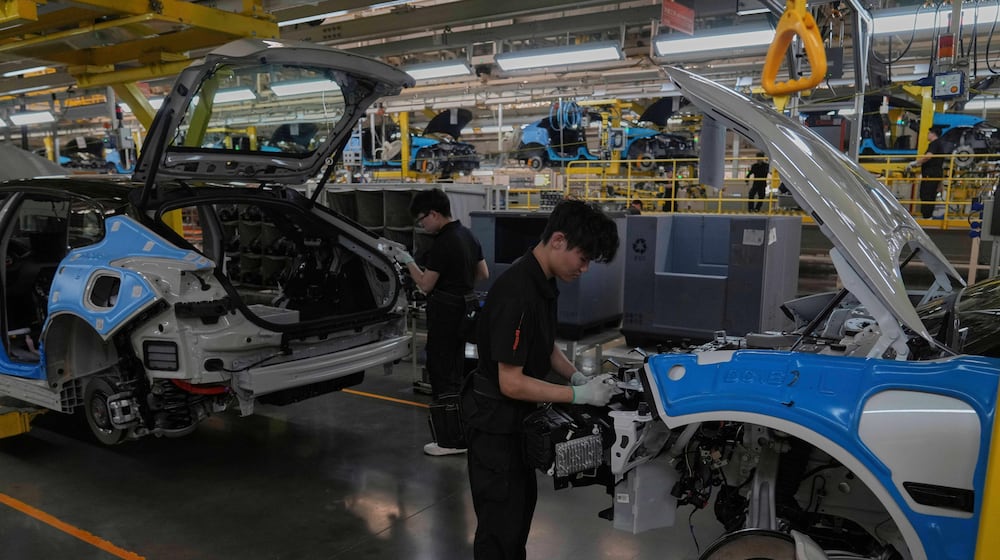 FILE - Workers assemble the Zeekr 001 EV models at the Chinese automaker Zeekr assembly plant in Ningbo, east China's Zhejiang Province, April 17, 2025. (AP Photo/Andy Wong, File)