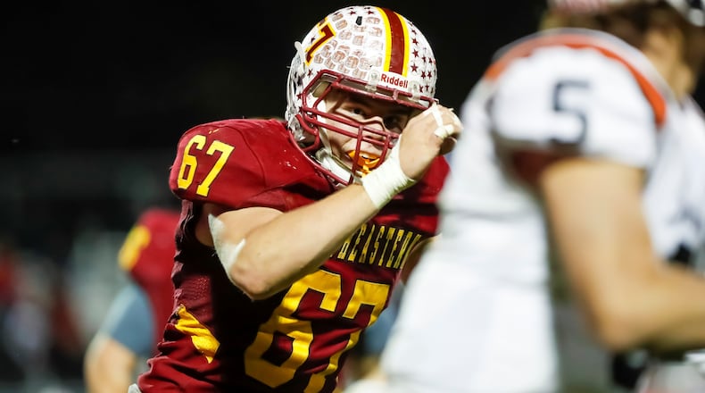Northeastern High School junior defensive end Brady Gillam runs after Waynesville quarterback Blaise Sizer during their game last week at Conover Field in Springfield. CONTRIBUTED PHOTO BY MICHAEL COOPER