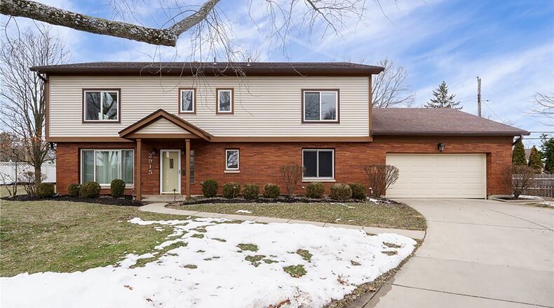 The brick and vinyl two story sits on the end of a cul-de-sac lot in Kettering