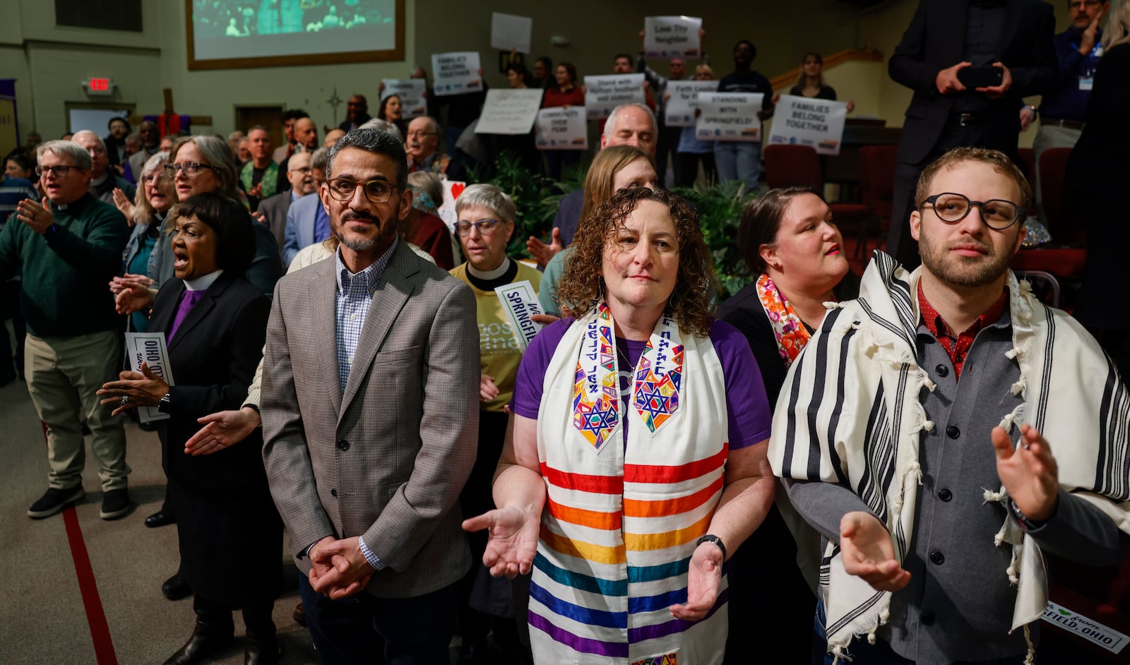 Faith leaders praise and sing along to music during Here We Stand: Faith Leaders for Immigration Justice & Family Unity at St. John Missionary Baptist Church on Monday, Feb. 2, 2026, in Springfield. Pastors and community members gathered to pray and call for the extension of Temporary Protected Status, which is scheduled to expire on Tuesday, Feb. 3, 2026. JOSEPH COOKE/STAFF
