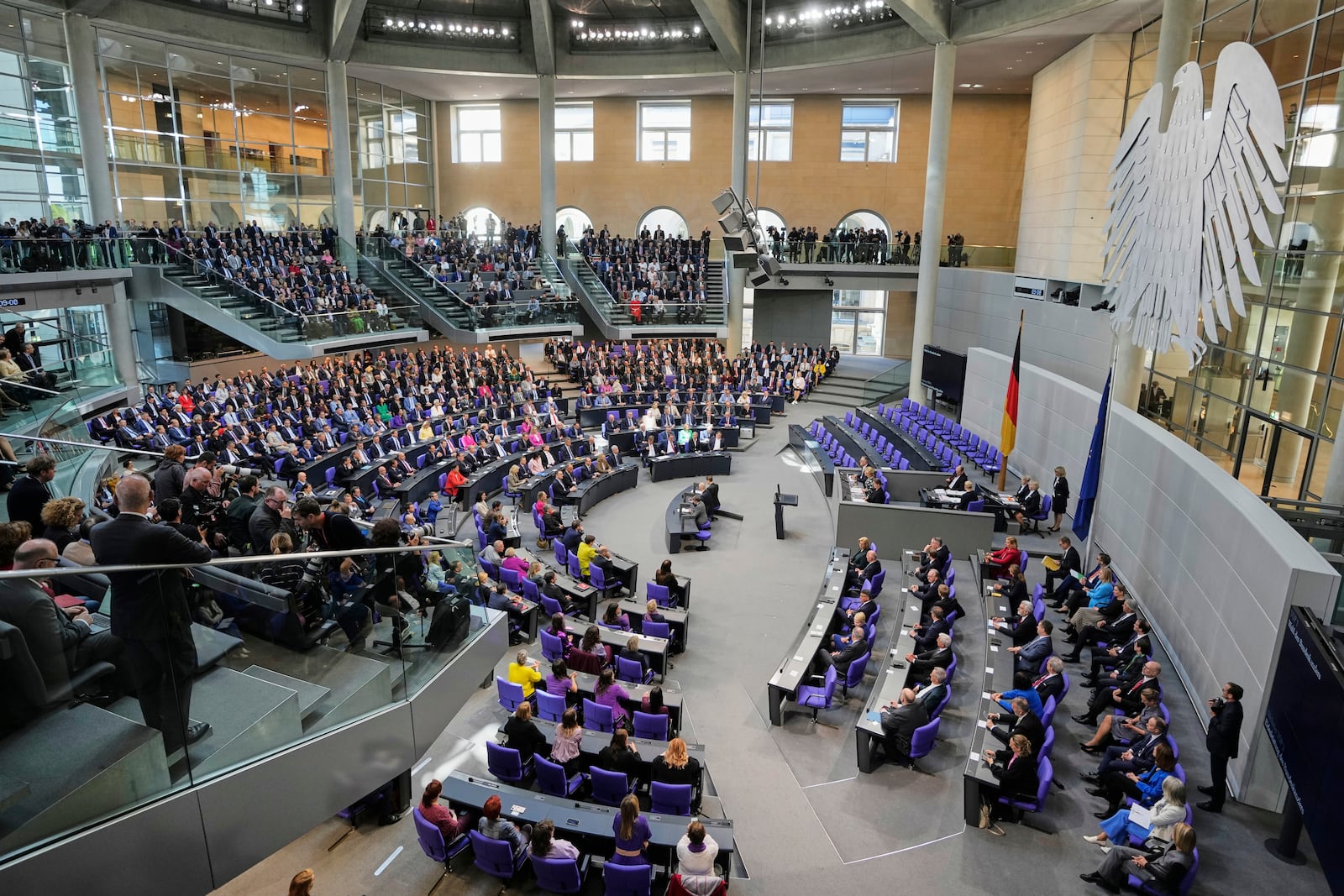 Lawmakers wait for the beginning of a session were Friedrich Merz is supposed to be elected new chancellor at the parliament Bundestag in Berlin, Tuesday, May 6, 2025. (AP Photo/Markus Schreiber)