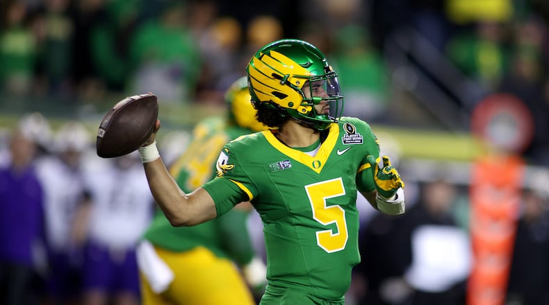 Oregon quarterback Dante Moore looks to pass the ball during the first half of the first round of the NCAA College Football Playoff against James Madison, Saturday, Dec. 20, 2025, in Eugene, Ore. (AP Photo/Lydia Ely)