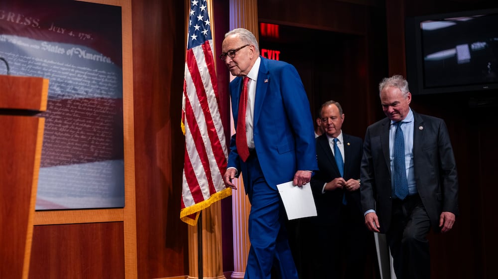 FILE — Senate Minority Leader Chuck Schumer (D-N.Y.), Sen. Tim Kaine (D-Va.), and Sen. Adam Schiff (D-Calif.) arrive at a news conference after the Senate blocked a resolution that sought to force President Donald Trump to seek congressional approval for any U.S. military action related to Venezuela at the U.S. Capitol in Washington, Jan. 14, 2026. Schumer called for Republicans to break off the homeland security funding measure and allow the Senate to approve funding for the rest of the government. (Eric Lee/The New York Times)