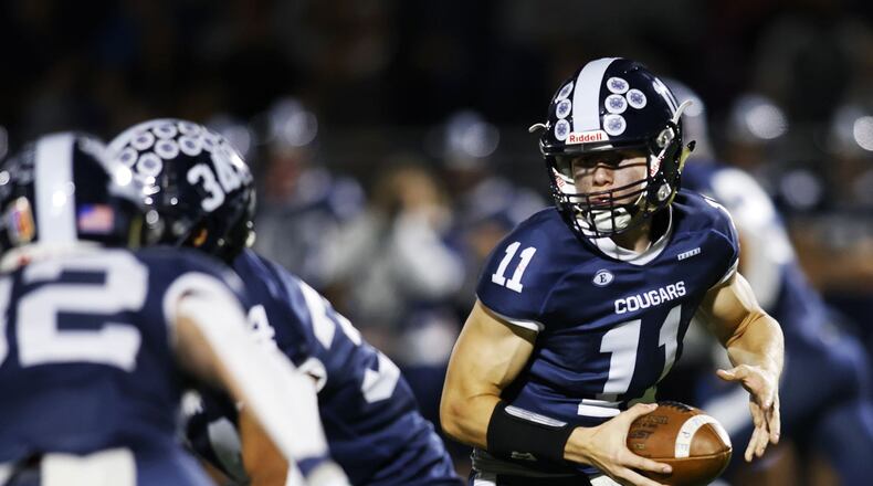 Edgewood's Riley Brown looks to hand off the ball during their playoff football game against Piqua Friday, Nov. 4, 2022 at Edgewood's Kumler Field. Edgewood won 21-14. NICK GRAHAM/STAFF