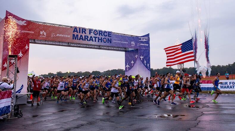 Fireworks go off at the start of the Air Force Marathon held Sept. 21, 2019, at Wright-Patterson Air Force Base. Fireworks at the start line were added to last year’s marathon to add more excitement and entertainment to the race. Again this year, gift registrations for the race can be purchased for junior enlisted members stationed at Wright-Patt Air Force Base. (U.S. Air Force photo/Wesley Farnsworth)