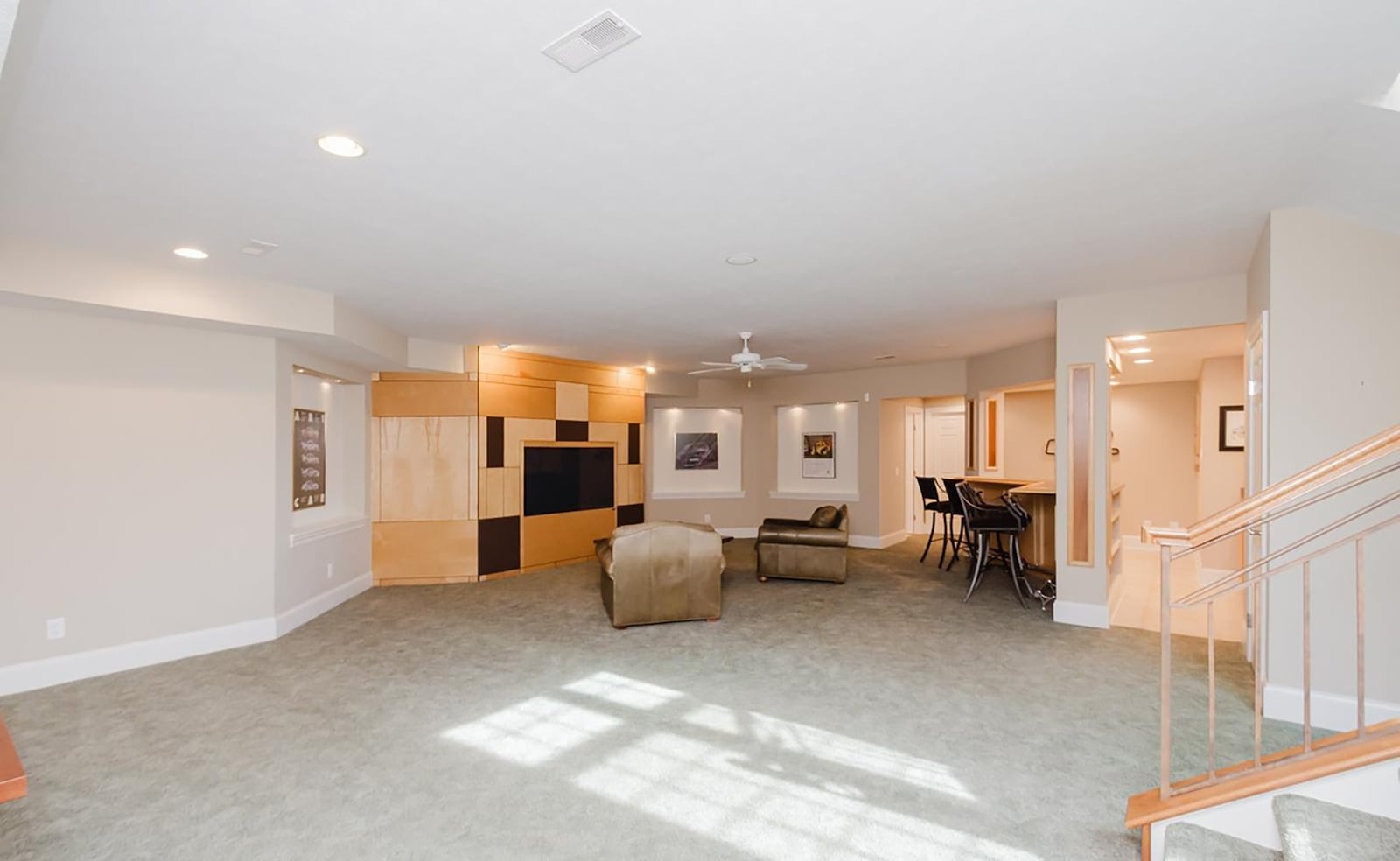 The finished basement features a recreation room with a wet bar, built in entertainment center and a half bathroom. CONTRIBUTED