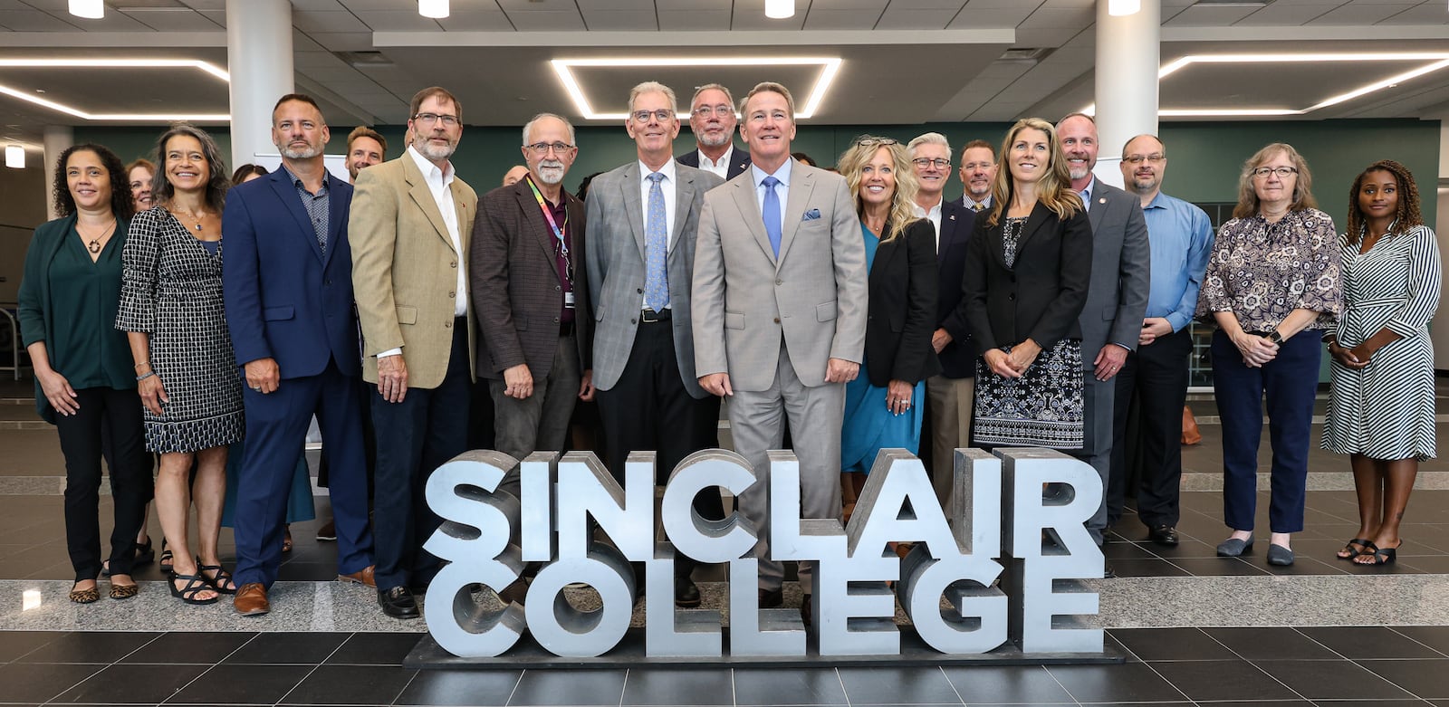 Sen. Jon Husted (center) poses with Sinclair Community College officials during a visit to campus on Wednesday, Aug. 13. BRYANT BILLING / STAFF