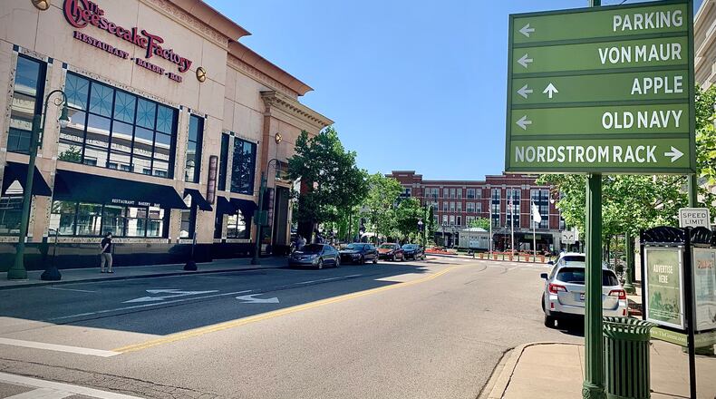 Signage points shoppers to some of the 100-plus stores and restaurants at The Greene Town Center in Beavercreek on Tuesday, May 16, 2024. MARSHALL GORBY / STAFF