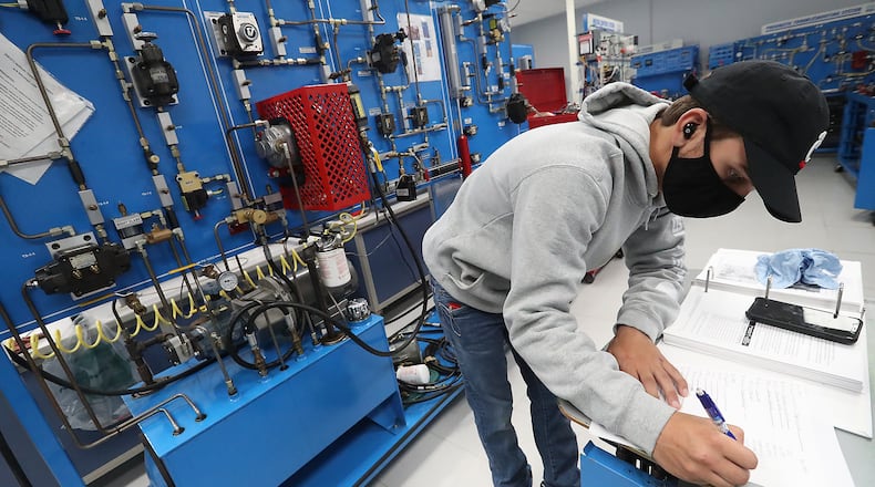 Jerisyn Gilliam works in a systems lab at Clark State Thursday. BILL LACKEY/STAFF