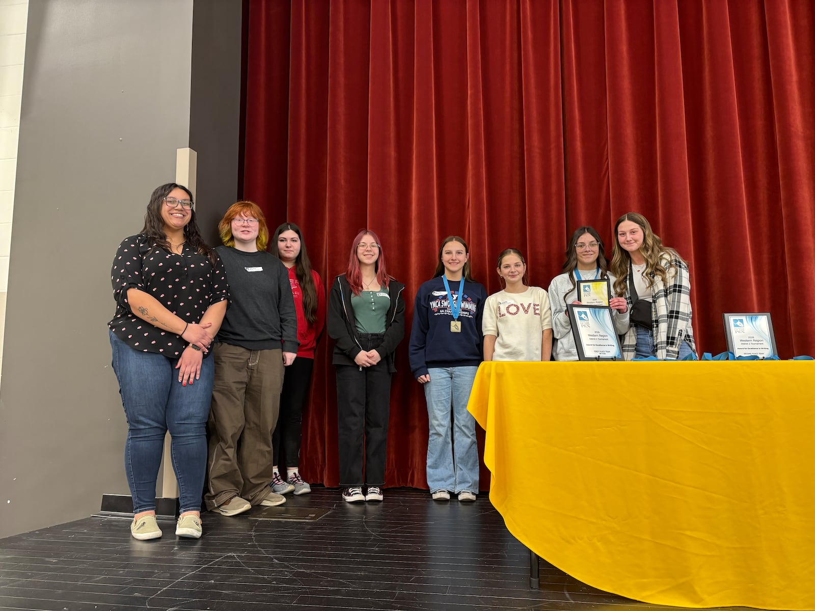 Shawnee Middle School 7th grade second place team with Coach Nyah Pierce during the second round of Western Region 7th and 8th grade creative writing Power of the Pen tournament. Contributed