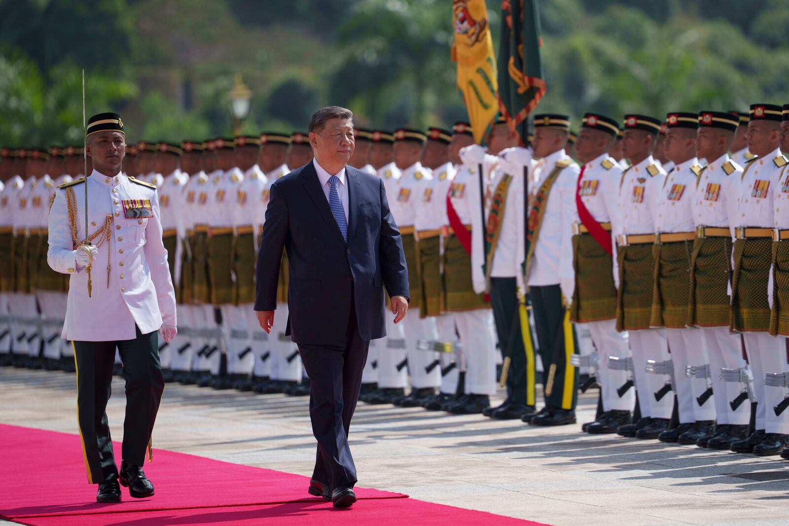Chinese President Xi Jinping inspects honor guards during the official welcoming ceremony at the national palace in Kuala Lumpur, Malaysia, Wednesday, April 16, 2025. (AP Photo/Vincent Thian, Pool)