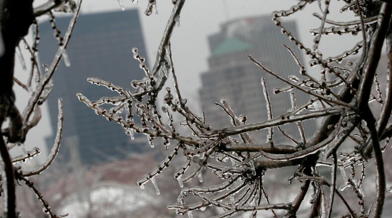 An overnight winter storm left the Miami Valley coated with ice Tuesday Feb. 1, 2011. Driving was tricky in spots and drivers spent time chipping the ice from windshields. More freezing rain may fall during the evening, turning to light rain and then possibly snow on Wednesday.